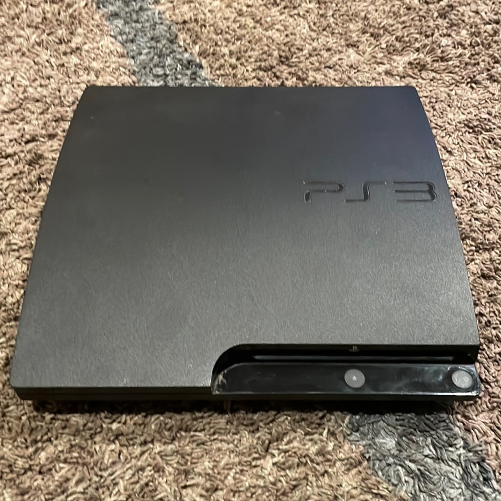 PS3 console and PS3 games with 2 controllers